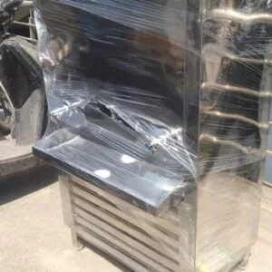 back side view of stainless steel water chiller machine showing water outlet and storage tank