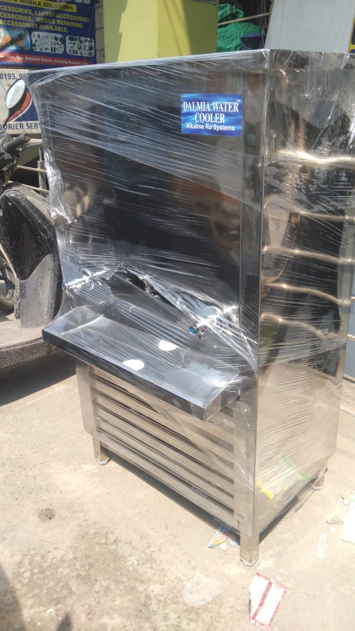 back side view of stainless steel water chiller machine showing water outlet and storage tank
