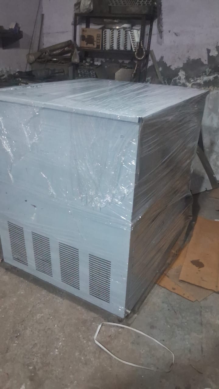 back side of commercial stainless steel water chiller showing cooling vents and compressor section
